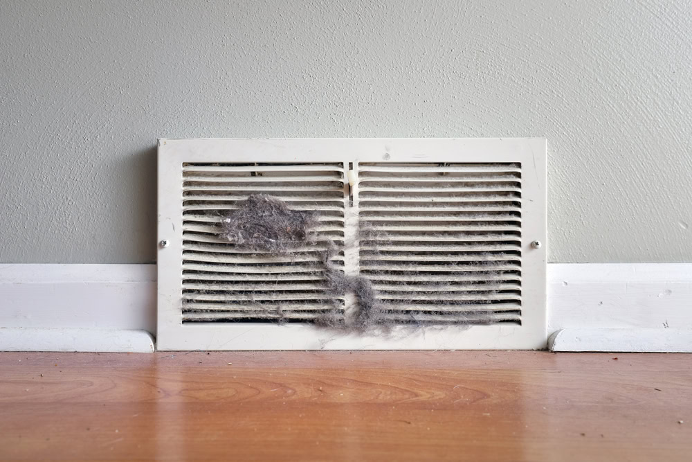 Dirty wall vent covered with dust
